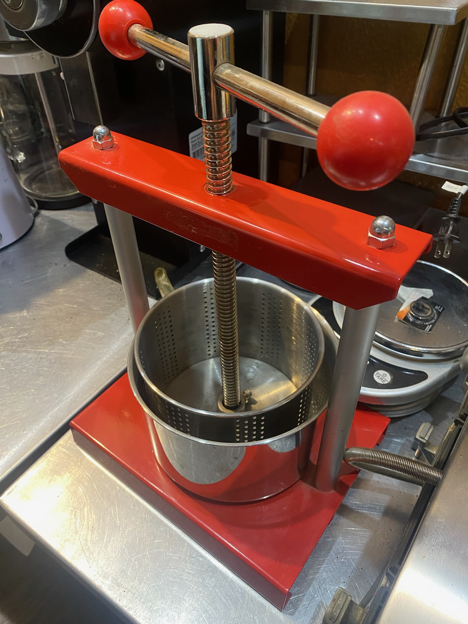 Smaller red twist-top tincture and juice press - Image 2